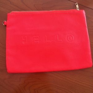 Laptop bag or clutch in a bright Lipstick pink/orange.